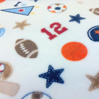 Wellsoft Winterstoffmuster in Creme mit beigen Ballmotiven